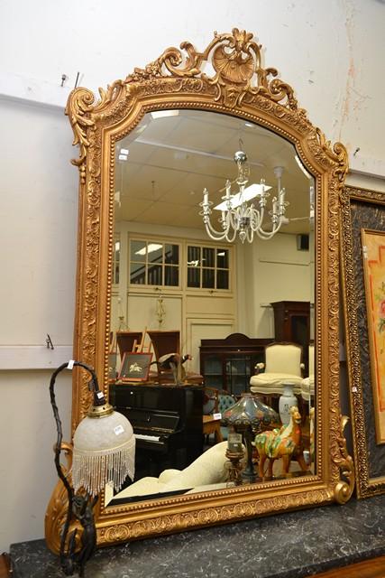 Appraisal: A FRENCH ORNATE GILT FRAMED MIRROR WITH SHELL MOTIF