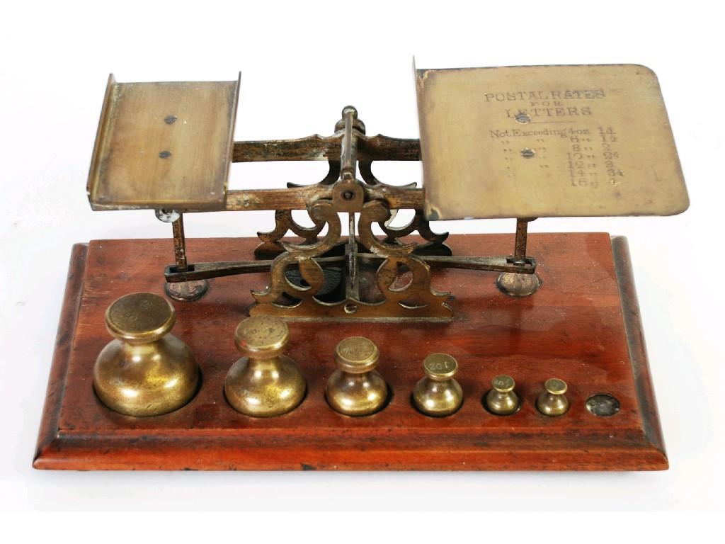 Appraisal: OLD BRASS POSTAL SCALES engraved with 'Postal Rates' on mahogany