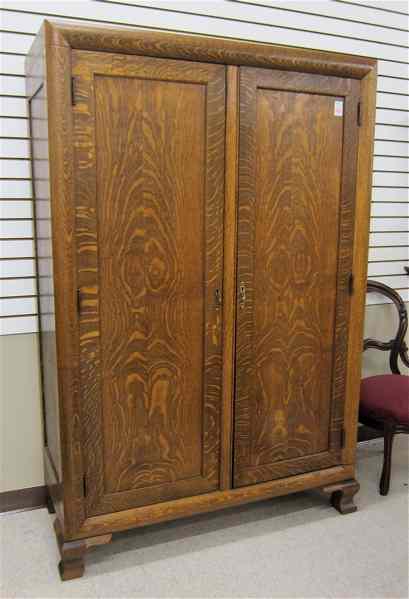 Appraisal: TWO-DOOR OAK WARDROBE Cron-Kills Co active - Piqua Ohio c