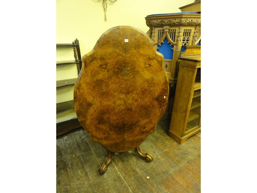 Appraisal: A Victorian figured and burr walnut veneered tilt top breakfast