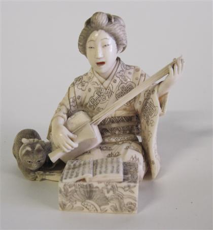 Appraisal: Japanese carved ivory figure of a beautySeated playing an stringed