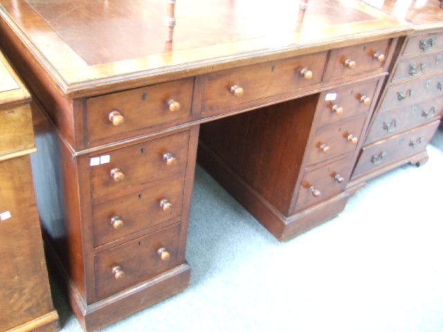 Appraisal: A th century mahogany pedestal desk the writing surface over