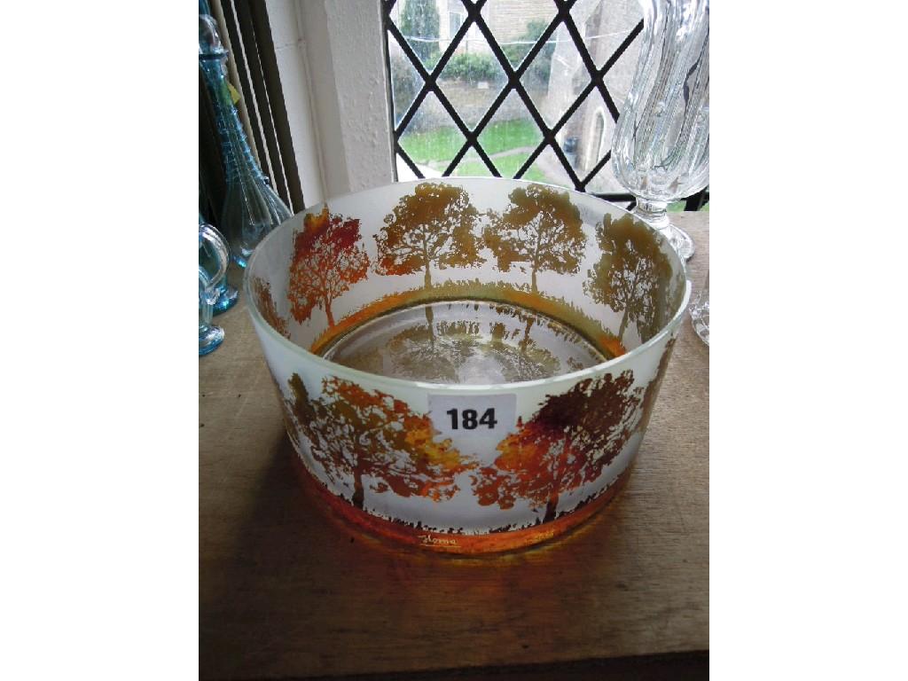 Appraisal: A glass bowl of circular form with amber coloured continuous