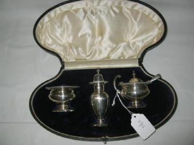 Appraisal: A THREE PIECE CONDIMENT SET of circular form with egg