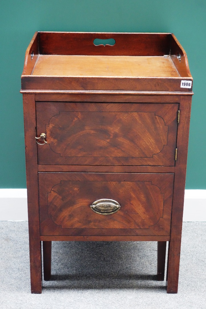 Appraisal: A George III mahogany night stand the three quarter galleried