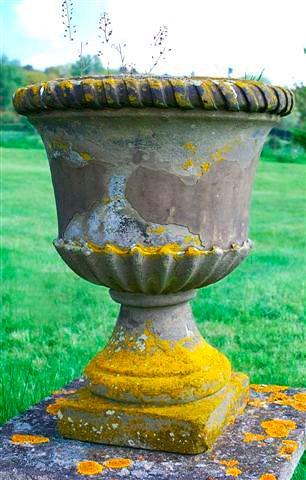 Appraisal: A Victorian sandstone urn with ribbon twisted rim and turned