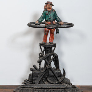 Appraisal: A Victorian Cold Painted Iron Umbrella Stand with Sailor Figure