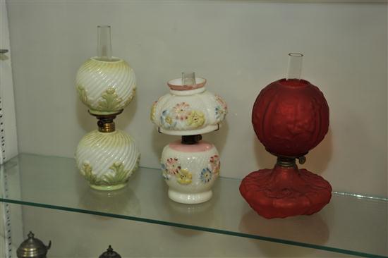 Appraisal: THREE MINIATURE LAMPS A red satin glass lamp having embossed