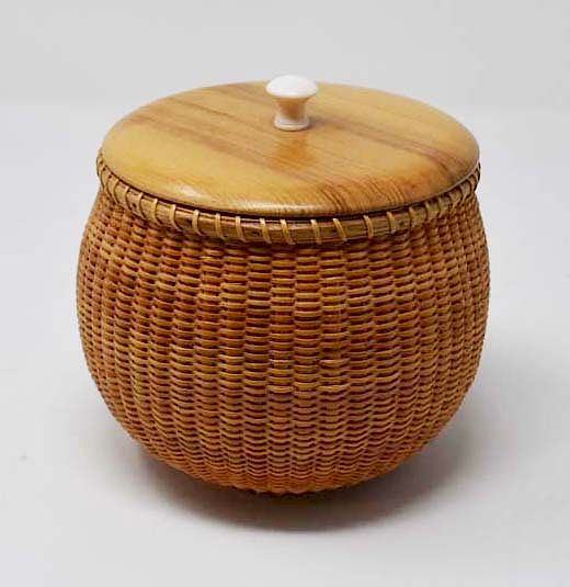 Appraisal: Nantucket basket with wooden lid Nantucket basket with wooden lid