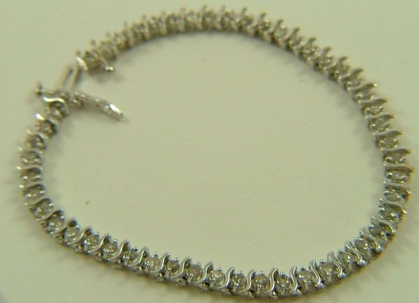 Appraisal: DIAMOND AND FOURTEEN KARAT WHITE GOLD BRACELET in length with