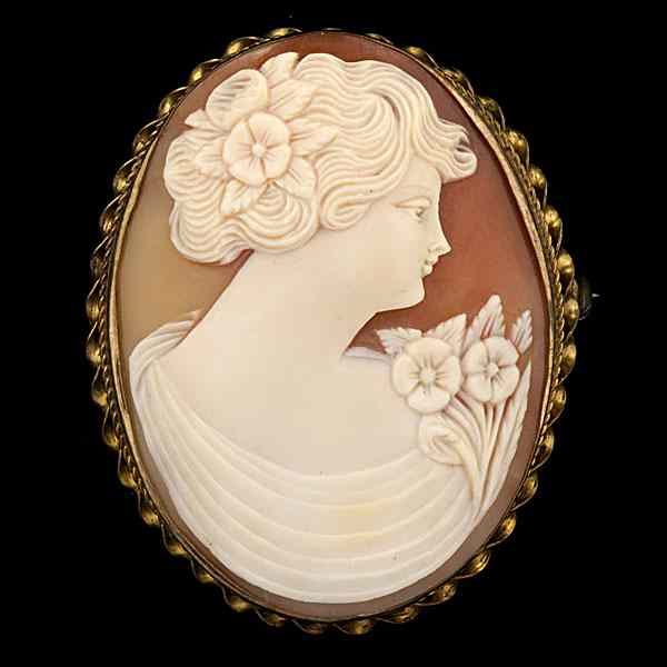 Appraisal: Large Simple Cameo A carved cameo portrait of a lady