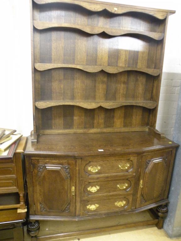 Appraisal: An oak dresser with three shelves the base with three