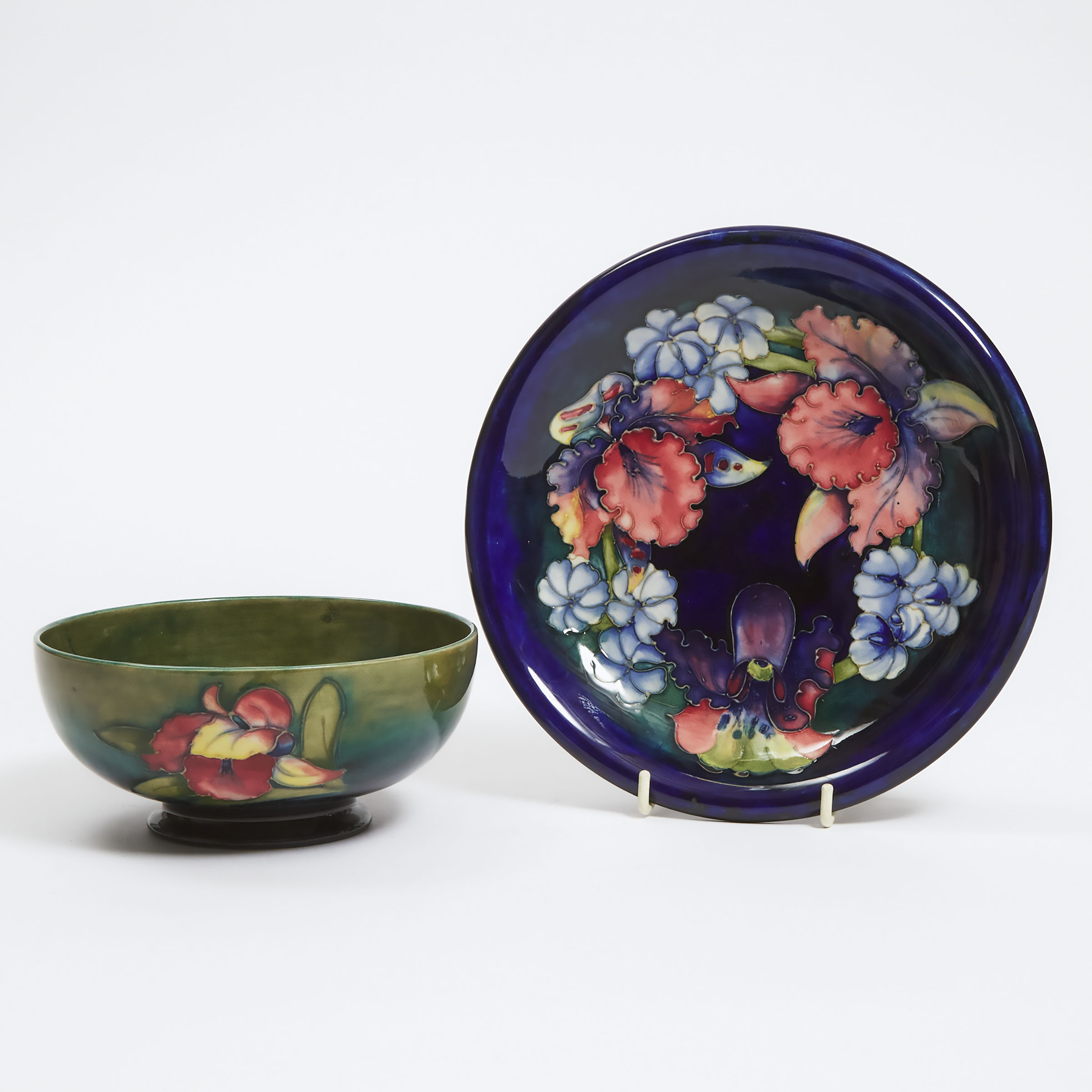 Appraisal: Moorcroft Orchids Bowl and Plate c diameter in cm diameter