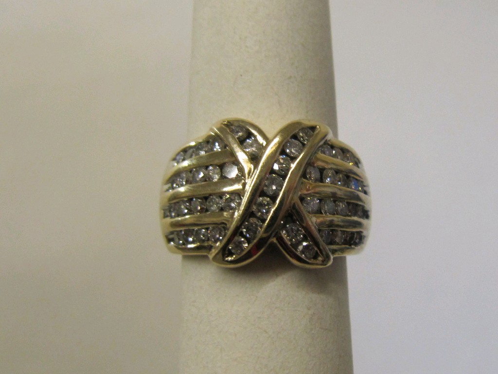 Appraisal: Nine carat gold channel set diamond set dress ring with