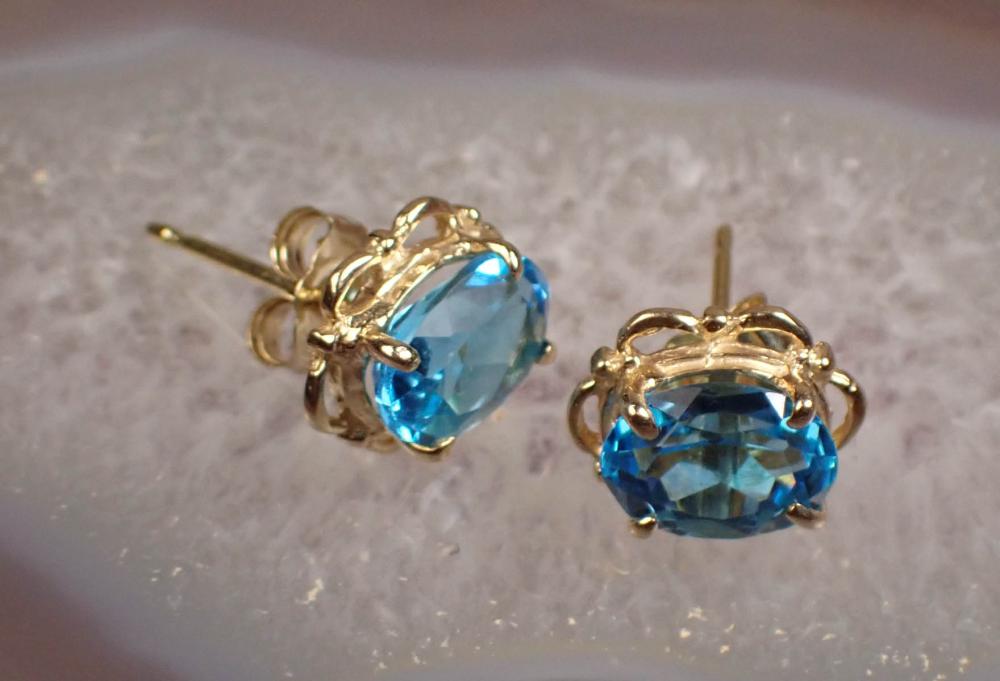 Appraisal: PAIR OF BLUE TOPAZ AND FOURTEEN KARAT GOLD EAR STUDS