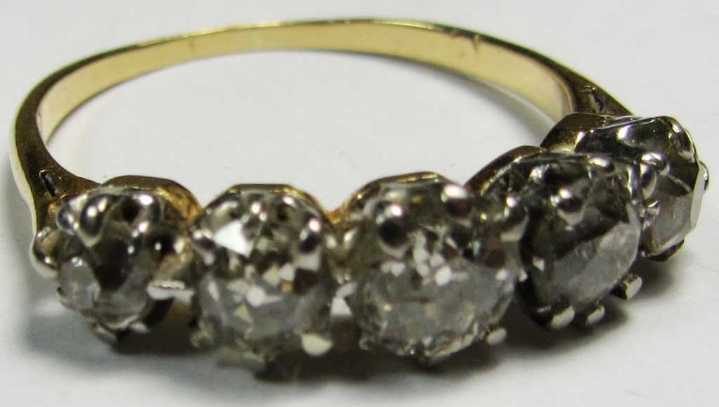 Appraisal: A gold and diamond set five stone ring claw set