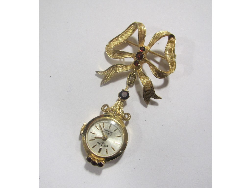 Appraisal: Nine carat gold Rotary lapel watch with garnet set bow