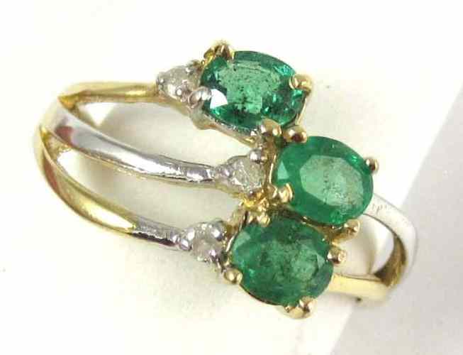 Appraisal: EMERALD DIAMOND AND FOURTEEN KARAT GOLD RING set with three