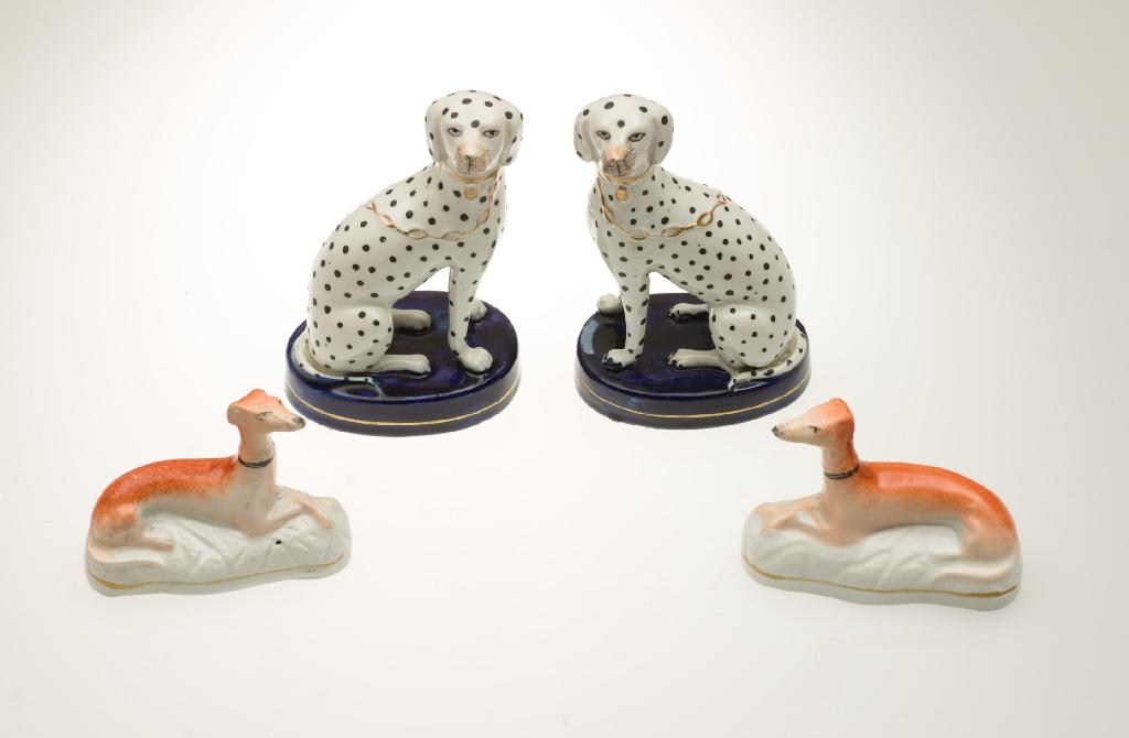 Appraisal: PAIR OF th CENTURY STAFFORDSHIRE MODELS OF SEATED DALMATIANS each