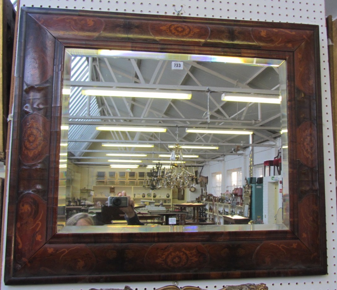 Appraisal: A William Mary style marquetry inlaid walnut retangular wall mirror