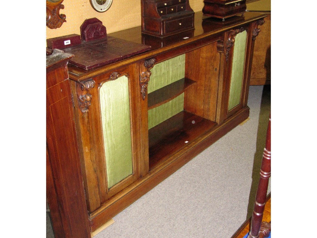 Appraisal: Victorian rosewood side cabinet the central open shelves flanked by