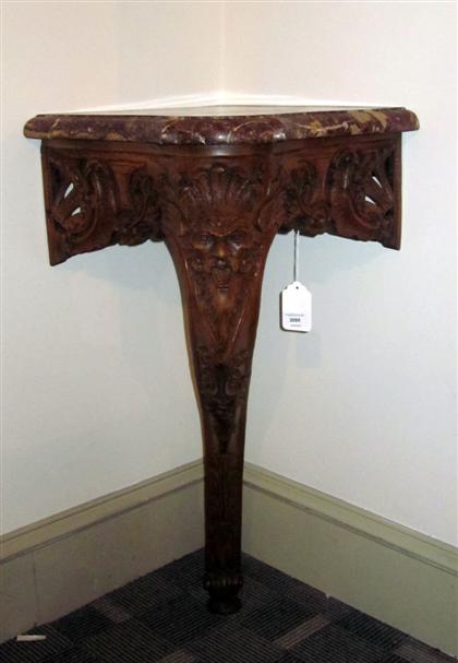 Appraisal: Louis XIV style carved walnut and rouge marble corner console