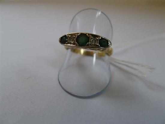 Appraisal: A EMERALD AND DIAMOND HALF HOOP RING IN CT GOLD