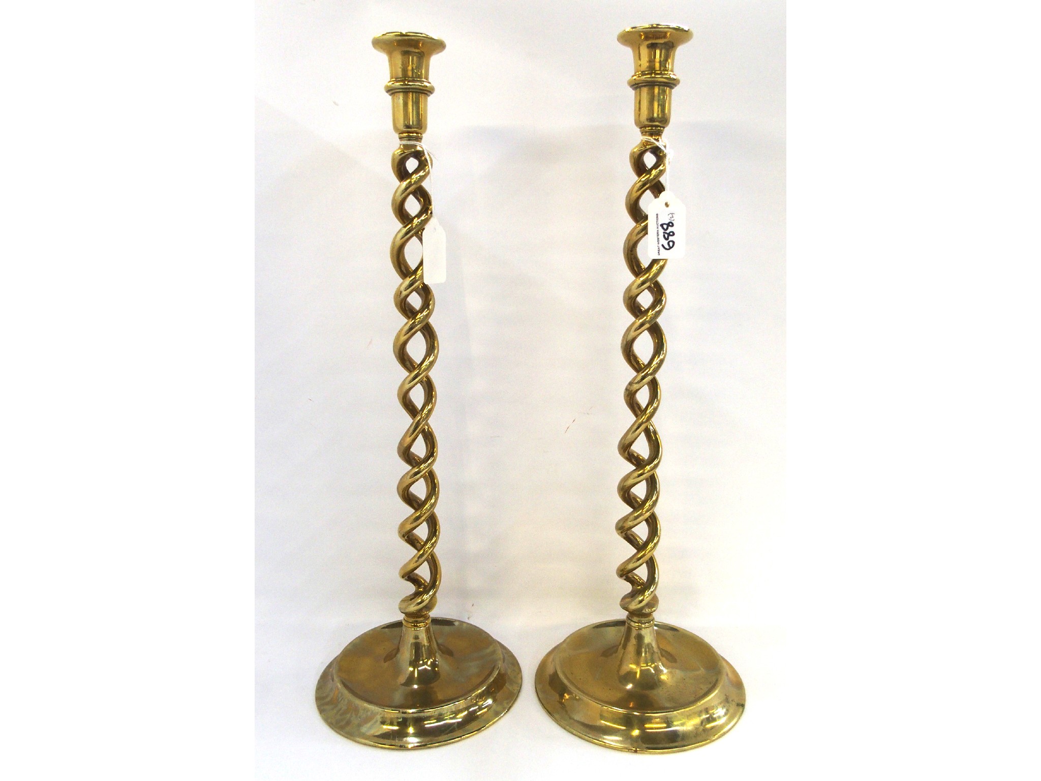 Appraisal: Pair of brass barley twist candlesticks