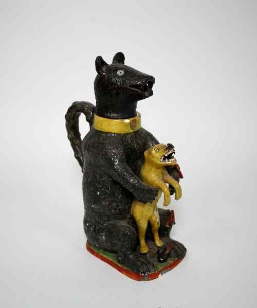 Appraisal: A pearlware' Bear Baiting' jug circa the head replaced modelled