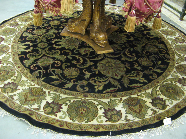 Appraisal: ROUND ORIENTAL CARPET Indo-Persian overall floral raceme design on midnight