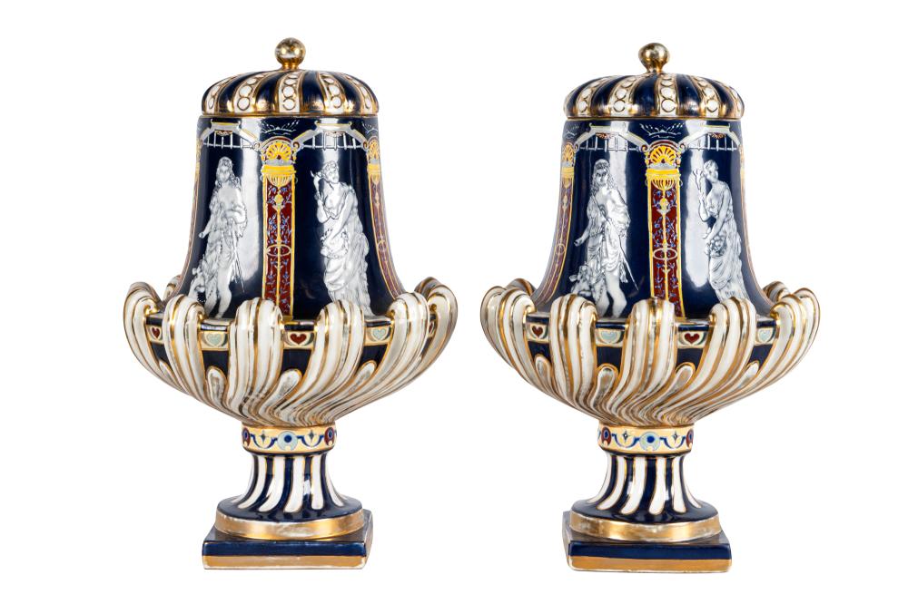 Appraisal: PAIR OF NEOCLASSICAL STYLE PORCELAIN COVERED URNSeach marked Minton to