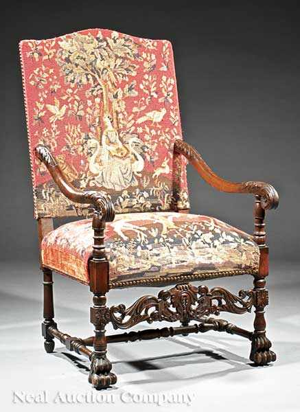 Appraisal: An Antique English Carved Walnut Armchair tall arched back acanthus