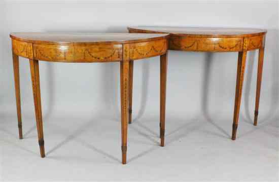 Appraisal: A pair of George III marquetry inlaid satinwood demi lune