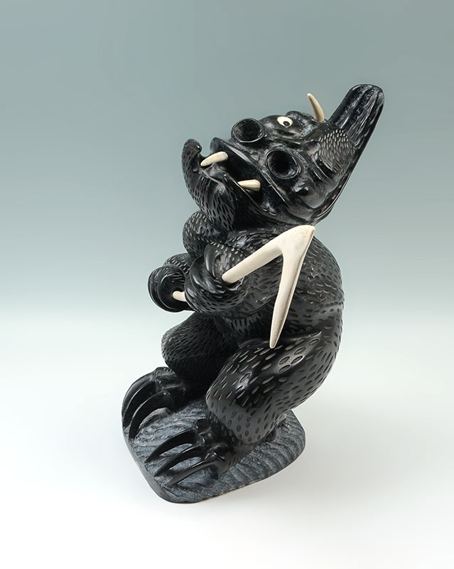 Appraisal: UGYUK Charlie Canadian Inuit - Grotesque carved figure of an