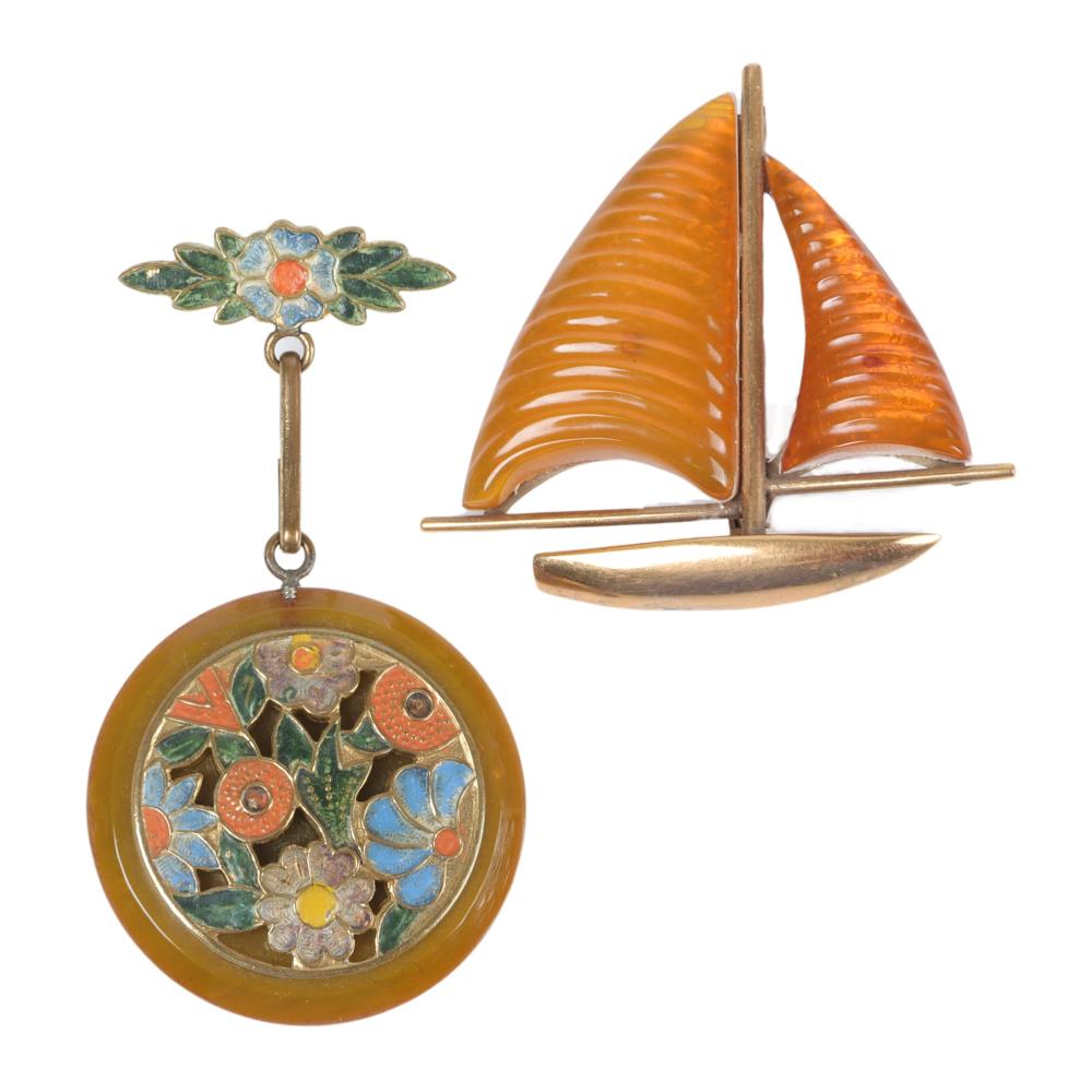 Appraisal: TWO APPLE JUICE BAKELITE PINS SAILBOAT WITH BRASS DECORATION H