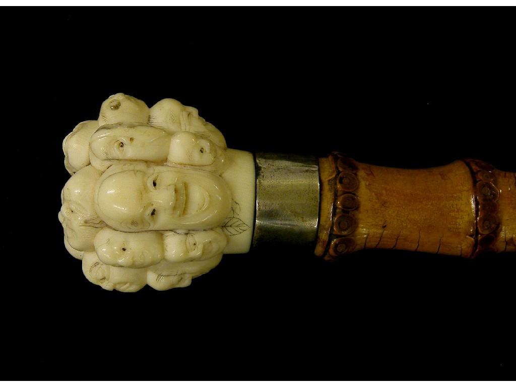 Appraisal: Japanese bamboo walking cane the bone knop carved with the