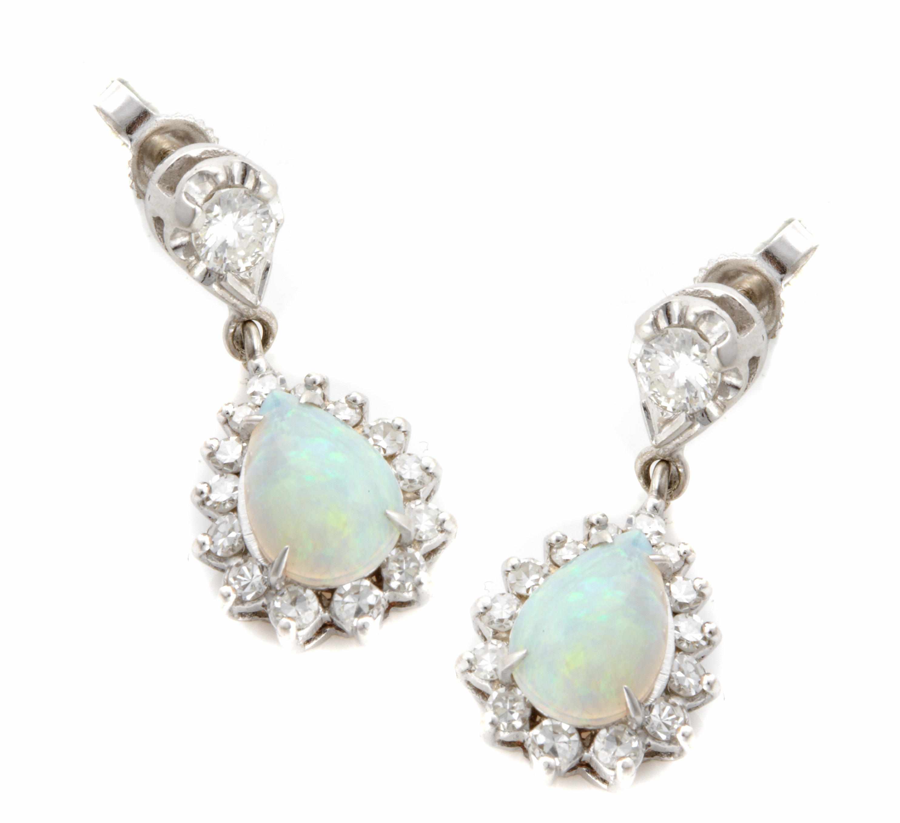 Appraisal: A pair of opal diamond and white gold earrings length