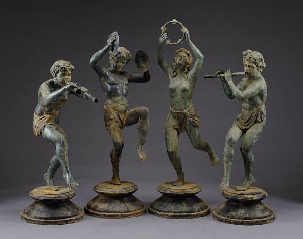 Appraisal: A set of four patinated bronze figures Each playing a