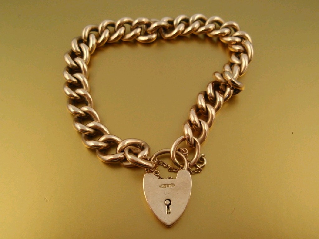 Appraisal: A hollow curb link bracelet with padlock clasp stamped ct