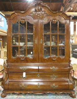 Appraisal: Dutch Rococo style bombe vitrine circa the superstructure having a