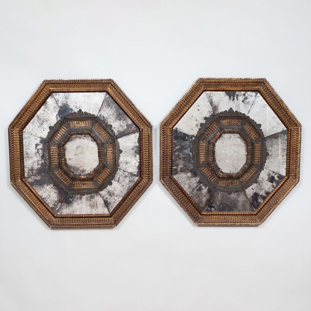 Appraisal: Pair of Rare Spanish Giltwood and Silver-Metal-Mounted Repouss Octagonal Mirrors