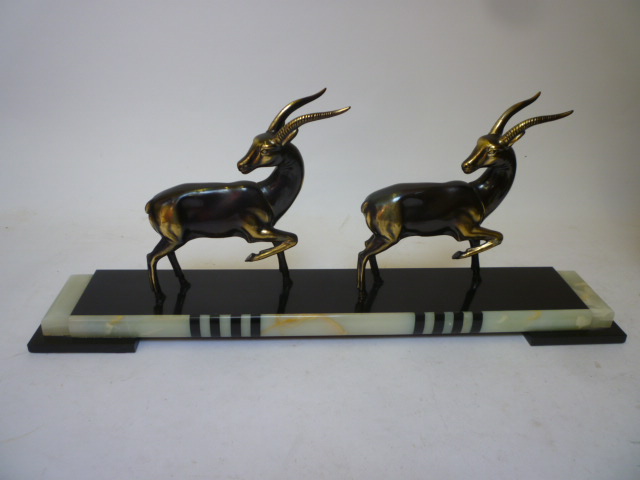 Appraisal: AN ART DECO GROUP with two bronzed spelter gazelles each