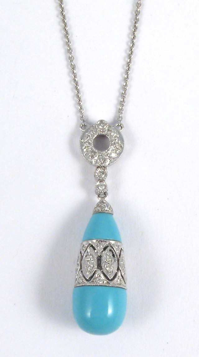 Appraisal: TURQUOISE AND DIAMOND PENDANT NECKLACE the pendant is suspended between