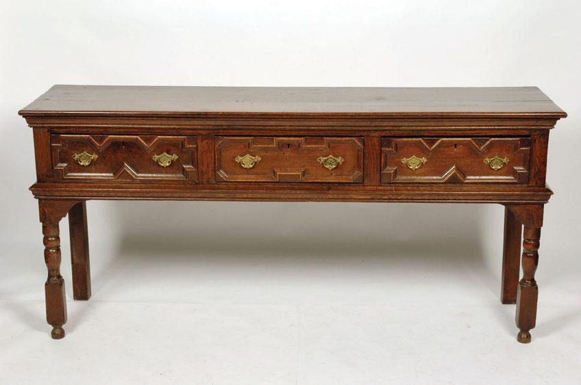 Appraisal: A GEORGE II OAK DRESSER BASE the rectangular top above