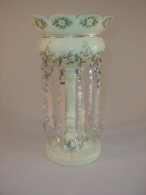 Appraisal: A Victorian milk glass table lustre with a petallated rim