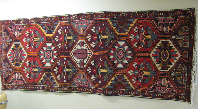 Appraisal: PERSIAN BAKHTIARI PANEL RUG featuring an all over motif of