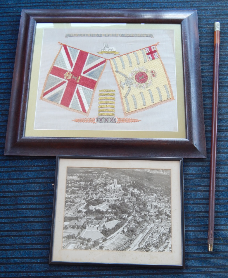 Appraisal: A Lincolnshire Regiment embroidered banner decorated with flags for North