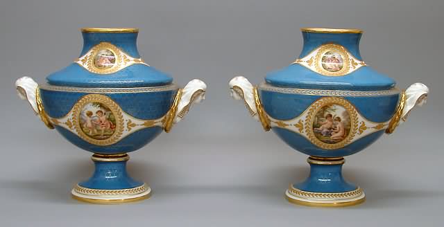 Appraisal: Twin-handled covered oval urn form with Egyptian heads oval medallions