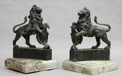 Appraisal: PAIR OF BRONZE LION ARMORIAL BEARERS Each supporting a cartouche