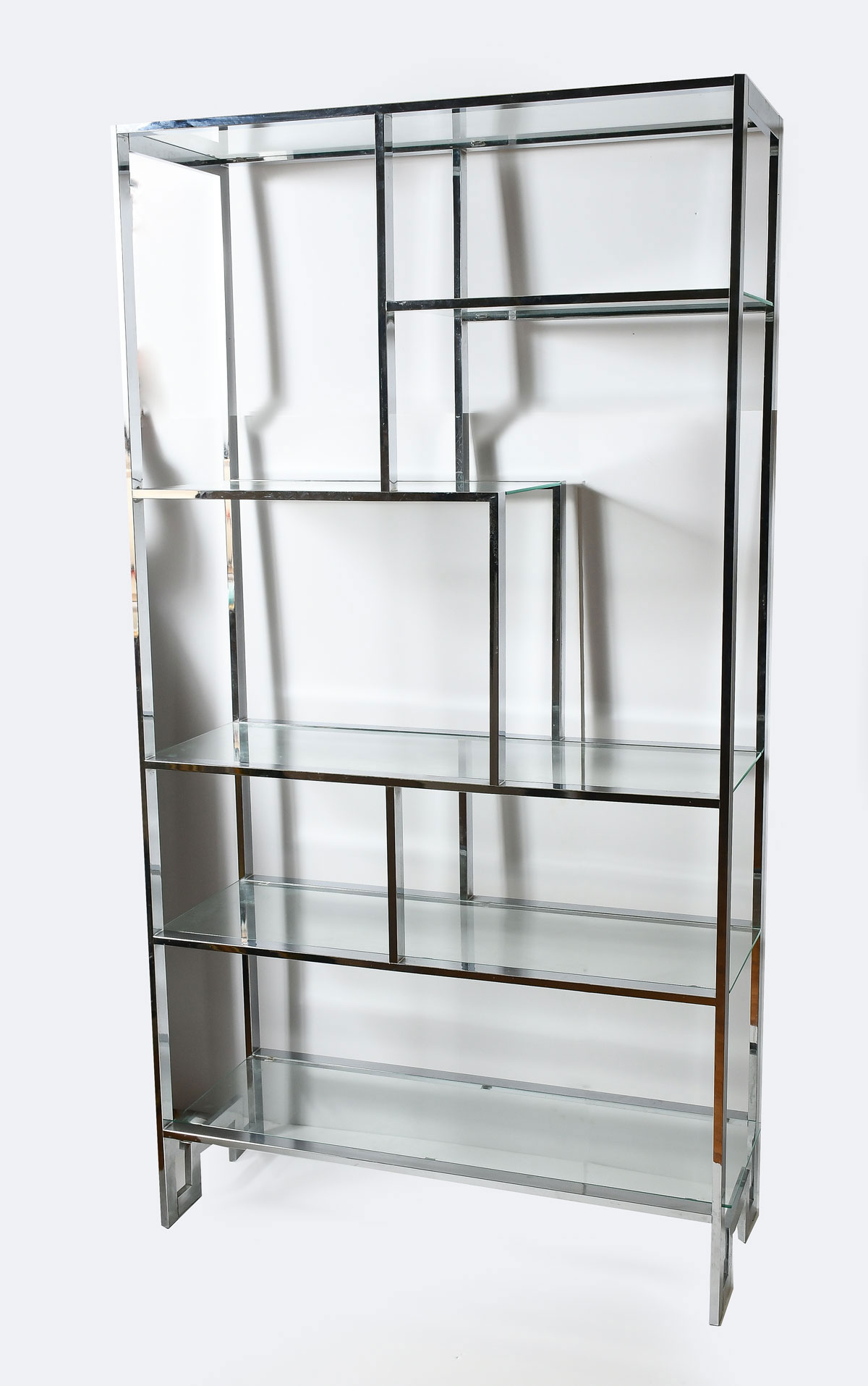 Appraisal: MILO BAUGHMAN THAYER COGGIN CHROMED ETAGERE Having five glass shelves